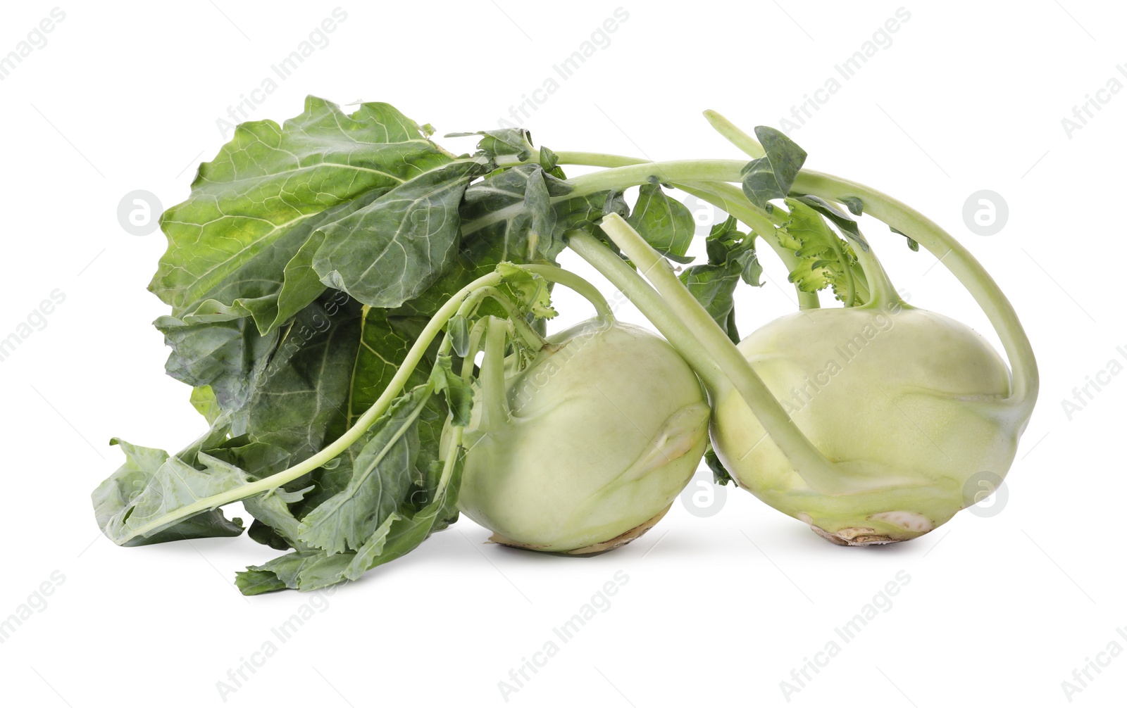 Photo of Whole ripe kohlrabies with leaves on white background