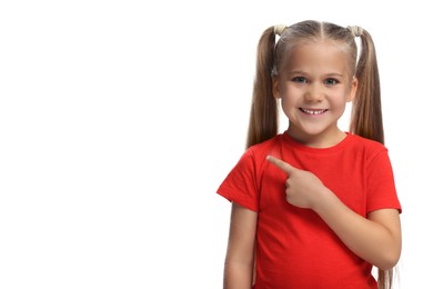 Special promotion. Little girl pointing at something on white background