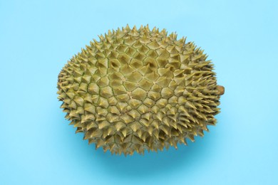 Fresh ripe durian on light blue background, top view