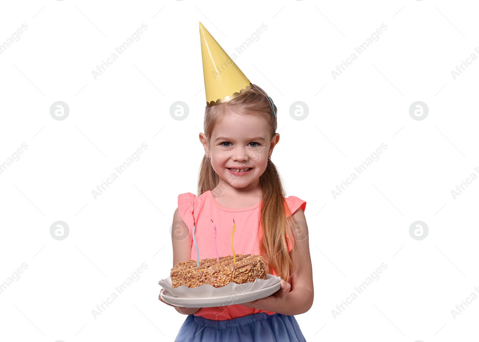 Photo of Birthday celebration. Cute little girl in party hat holding tasty cake on white background