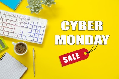 Cyber Monday Sale. Modern keyboard and stationery on yellow background, flat lay