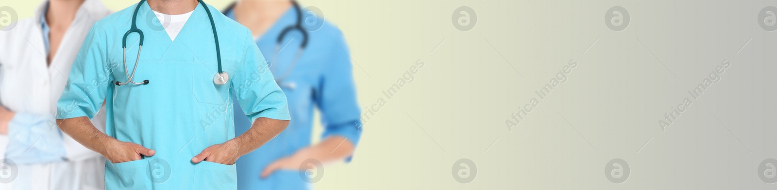 Image of Doctors and nurse on light background, closeup. Banner design with space for text