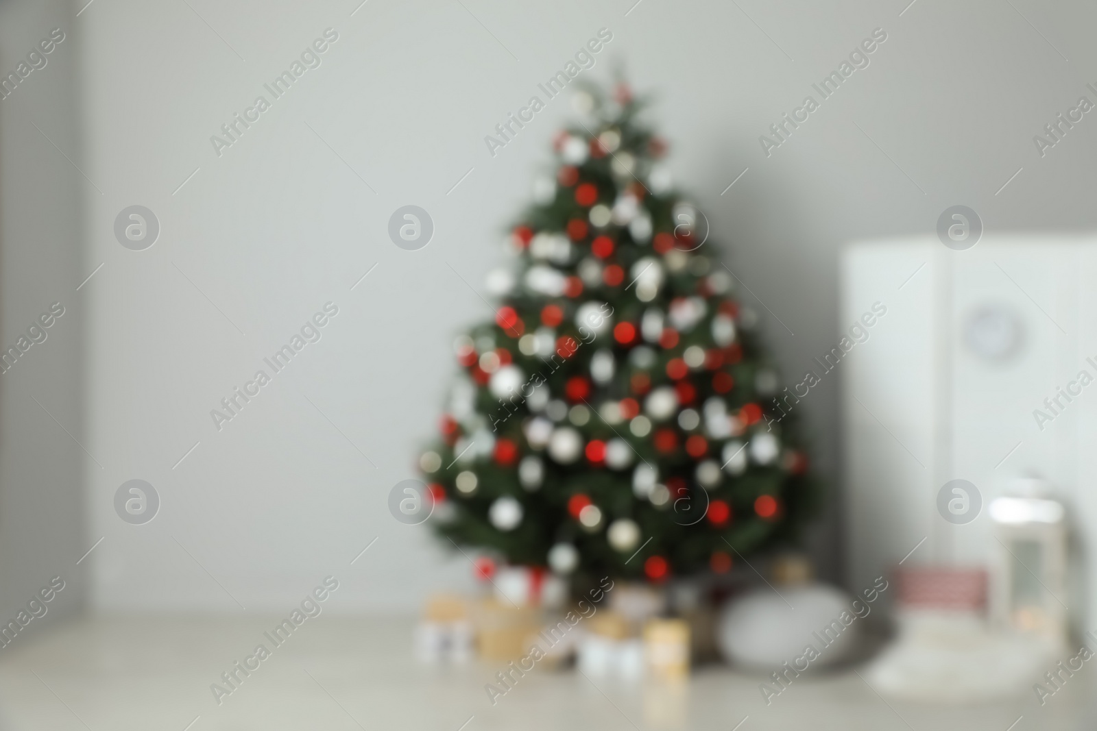 Photo of Blurred view of beautifully decorated Christmas tree in room