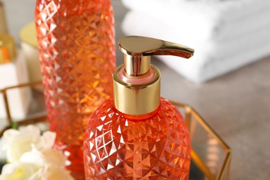 Photo of Stylish dispenser with liquid soap, closeup view