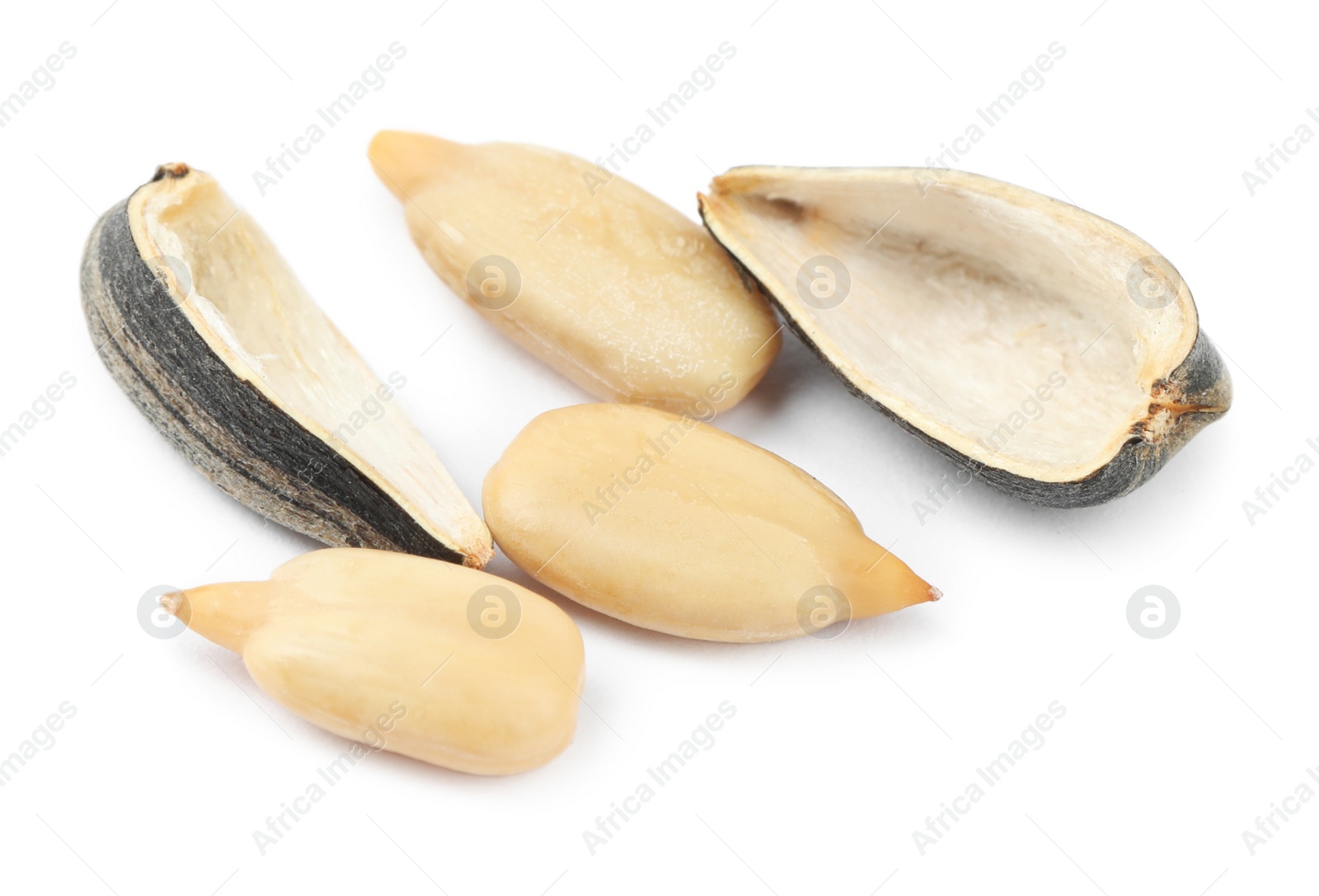 Photo of Raw peeled sunflower seeds and shell isolated on white