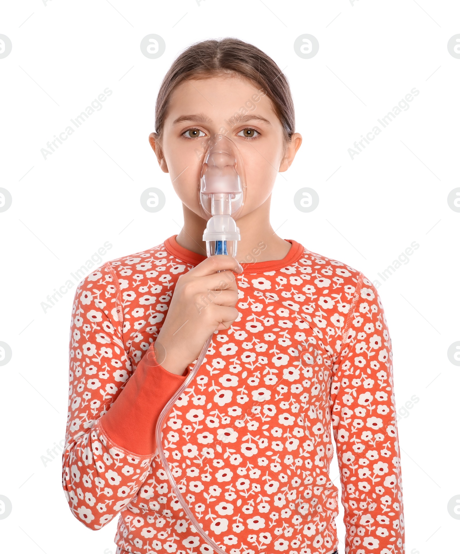 Photo of Cute girl using nebulizer for inhalation on white background