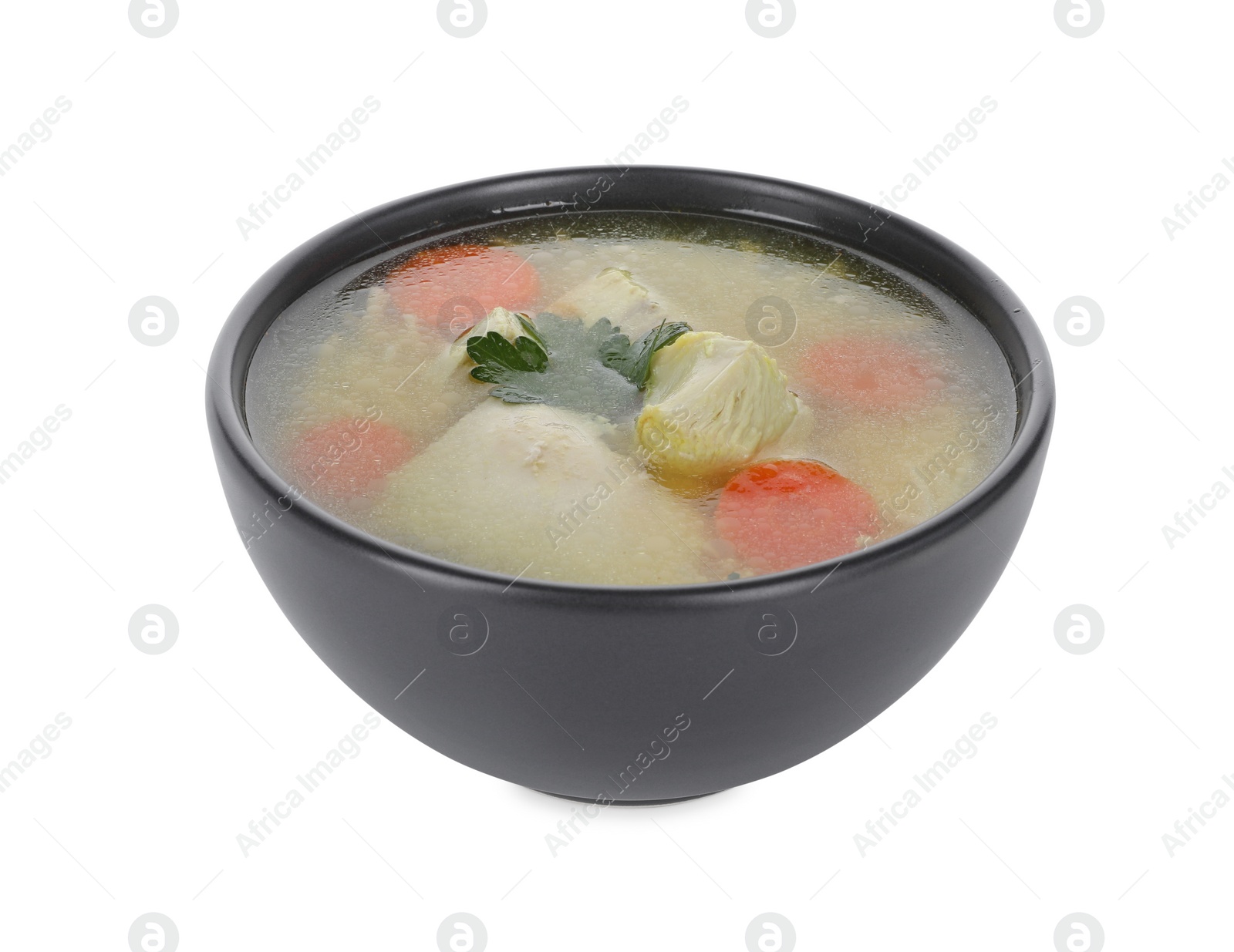 Photo of Tasty chicken soup with vegetables and parsley in bowl isolated on white