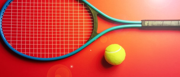 Image of Tennis racket and ball on red background, flat lay. Banner design