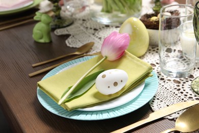 Photo of Festive table setting with beautiful tulip, closeup. Easter celebration