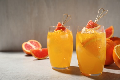 Photo of Delicious orange soda water on light table