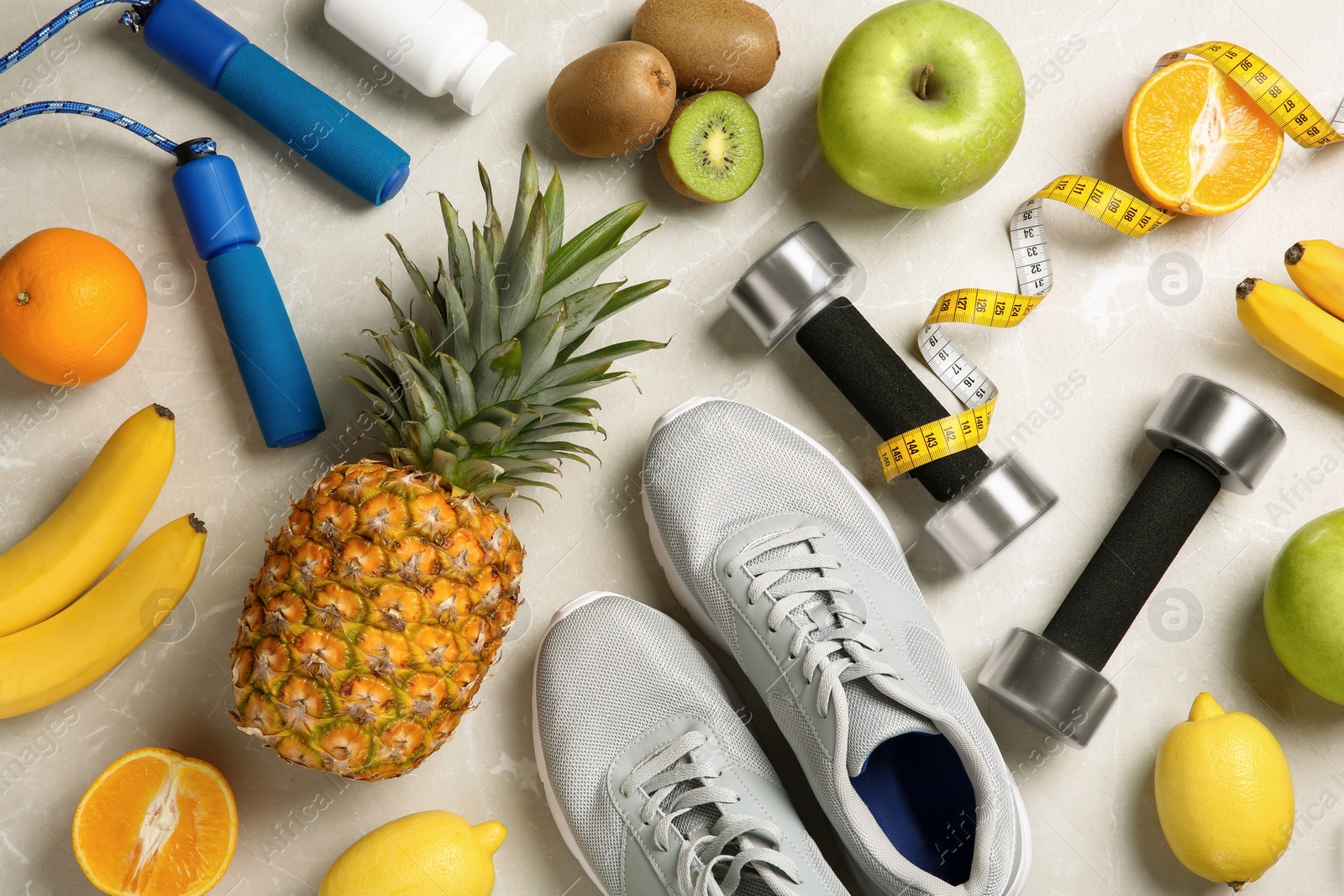 Photo of Flat lay composition with sport items and healthy food on grey background. Weight loss concept