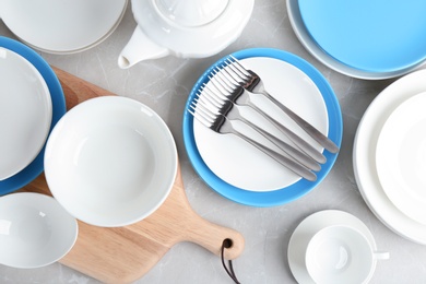 Photo of Flat lay composition with ceramic dishware on table