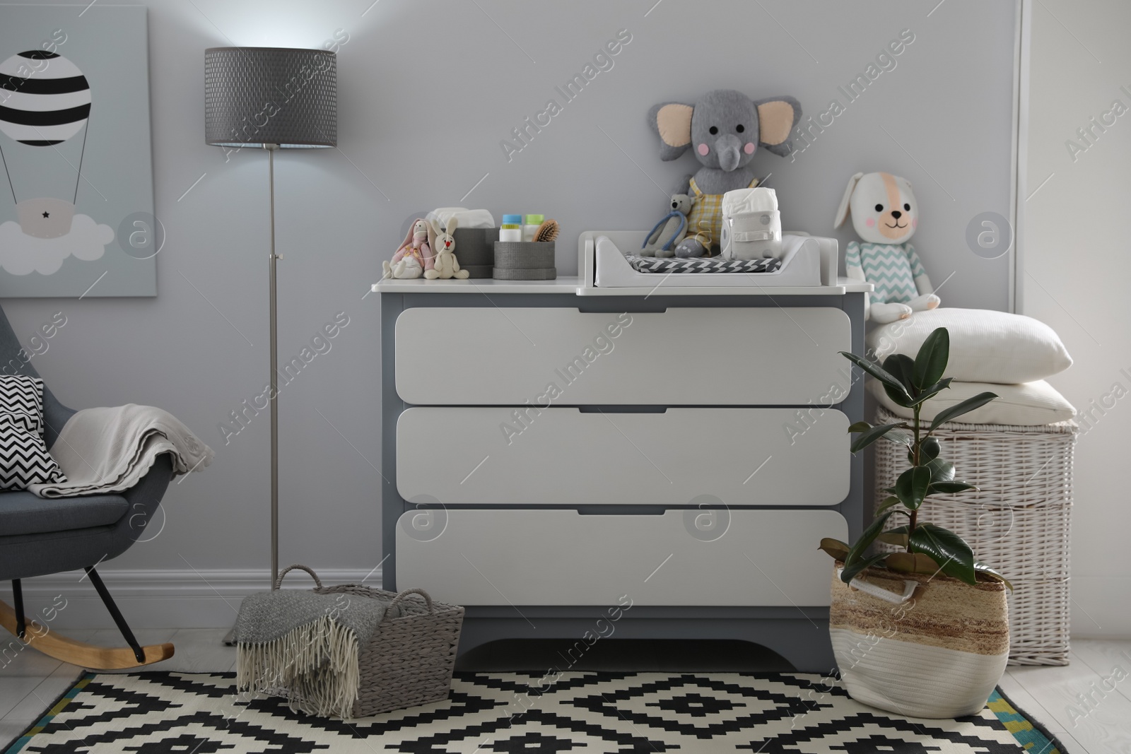 Photo of Beautiful baby room interior with modern changing table