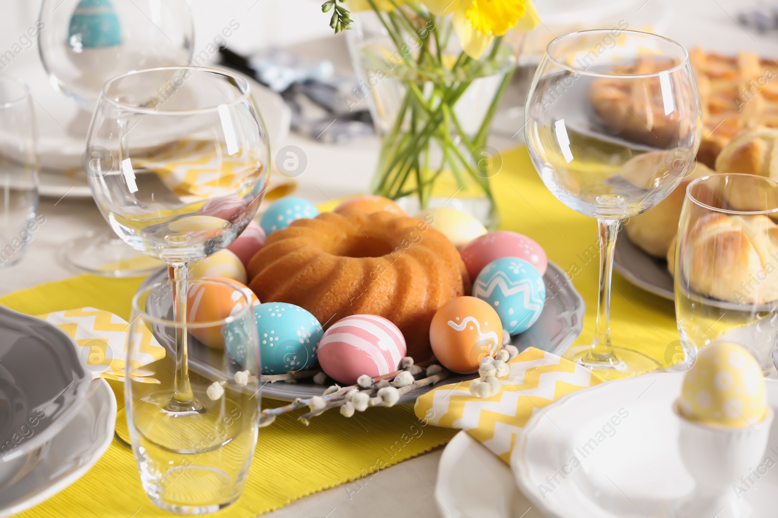 Photo of Festive Easter table setting with traditional meal