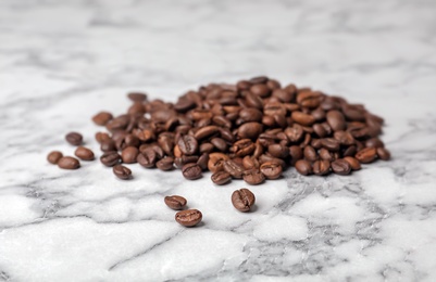 Coffee beans on marble background