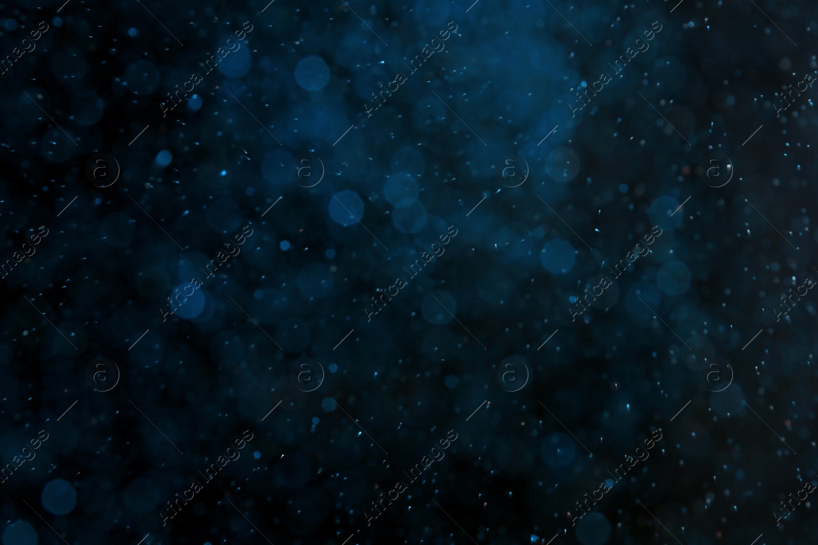 Photo of Color glitter on dark background. Bokeh effect