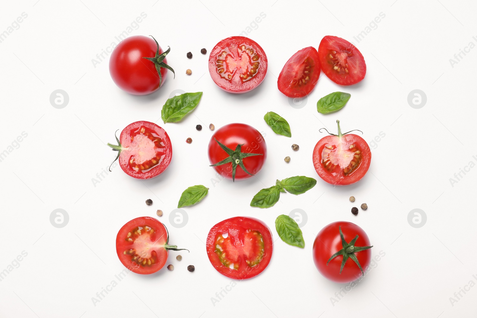 Photo of Fresh basil leaves and tomatoes on white background, flat lay