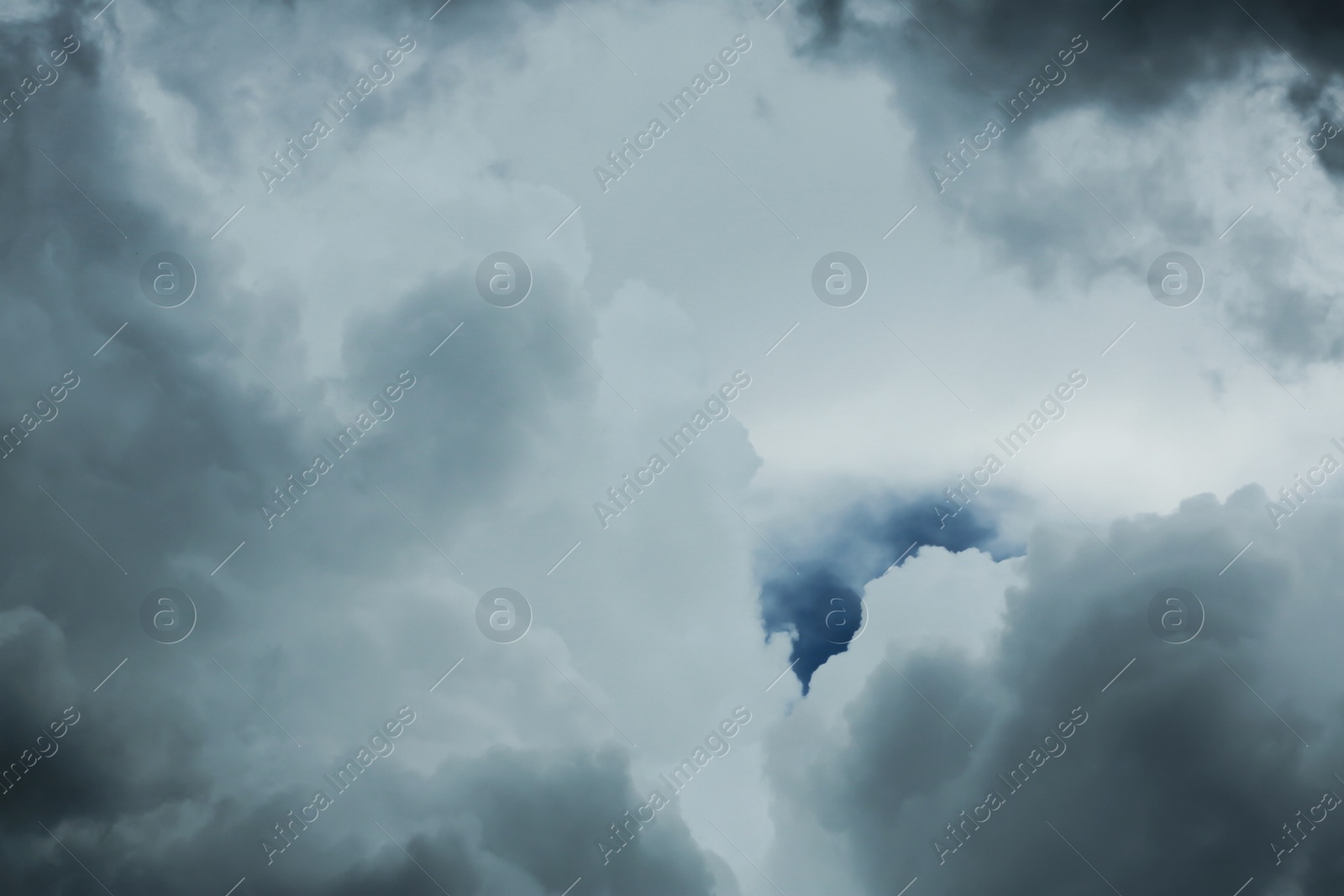 Photo of Sky with heavy rainy clouds on grey day