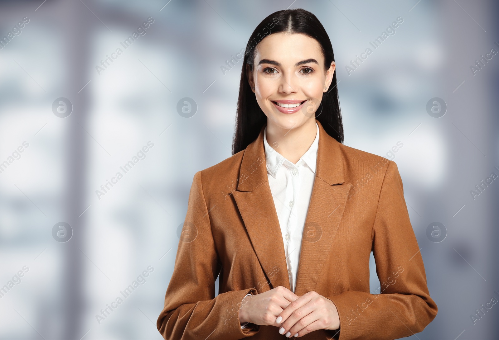 Image of Beautiful real estate agent in office, space for text