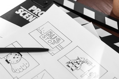 Photo of Storyboard with cartoon sketches at workplace, closeup. Pre-production process