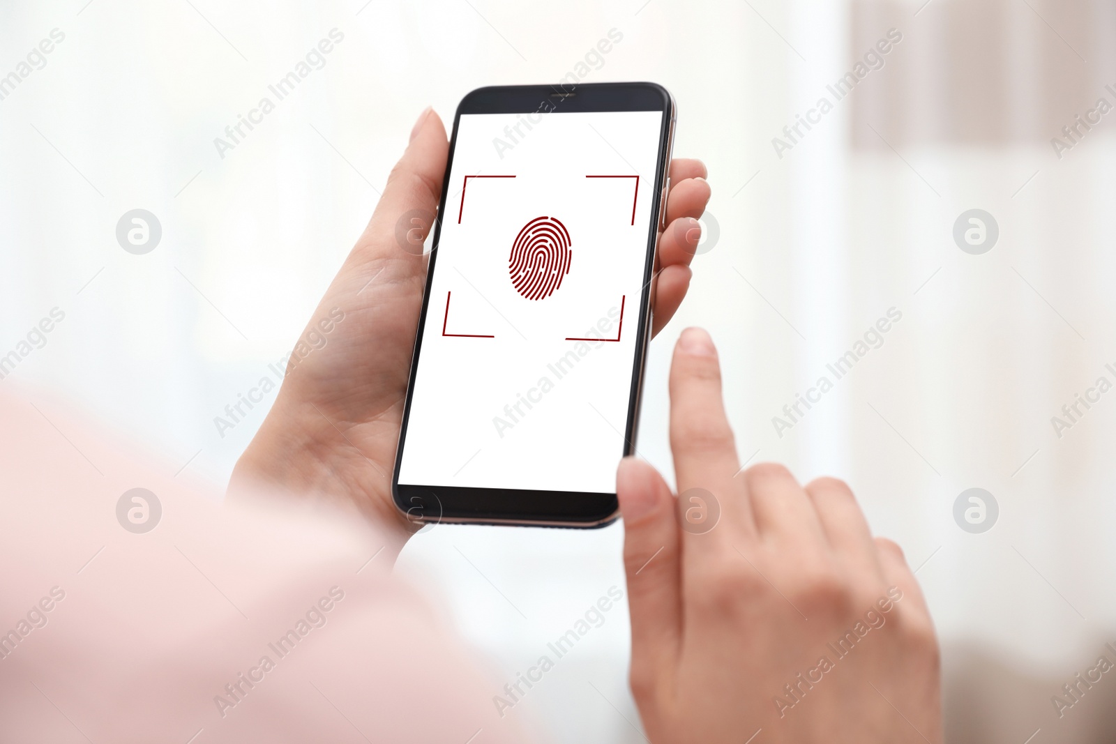 Image of Woman holding smartphone with fingerprint sensor indoors, closeup. Digital identity