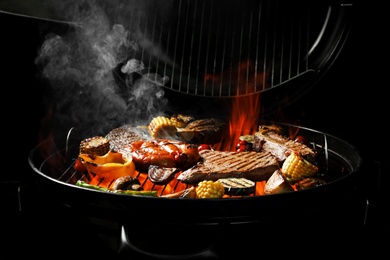 Assorted delicious meat and vegetables on barbecue grill