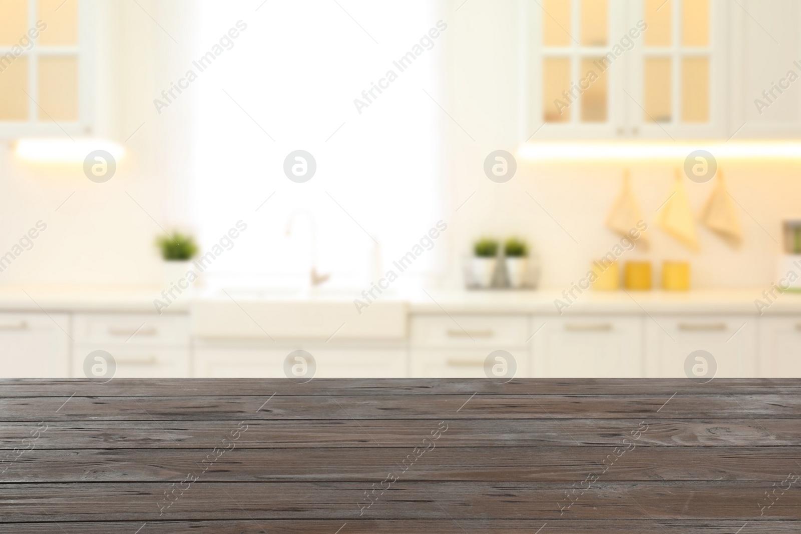 Image of Empty wooden table and blurred view of stylish kitchen interior. Mockup for design