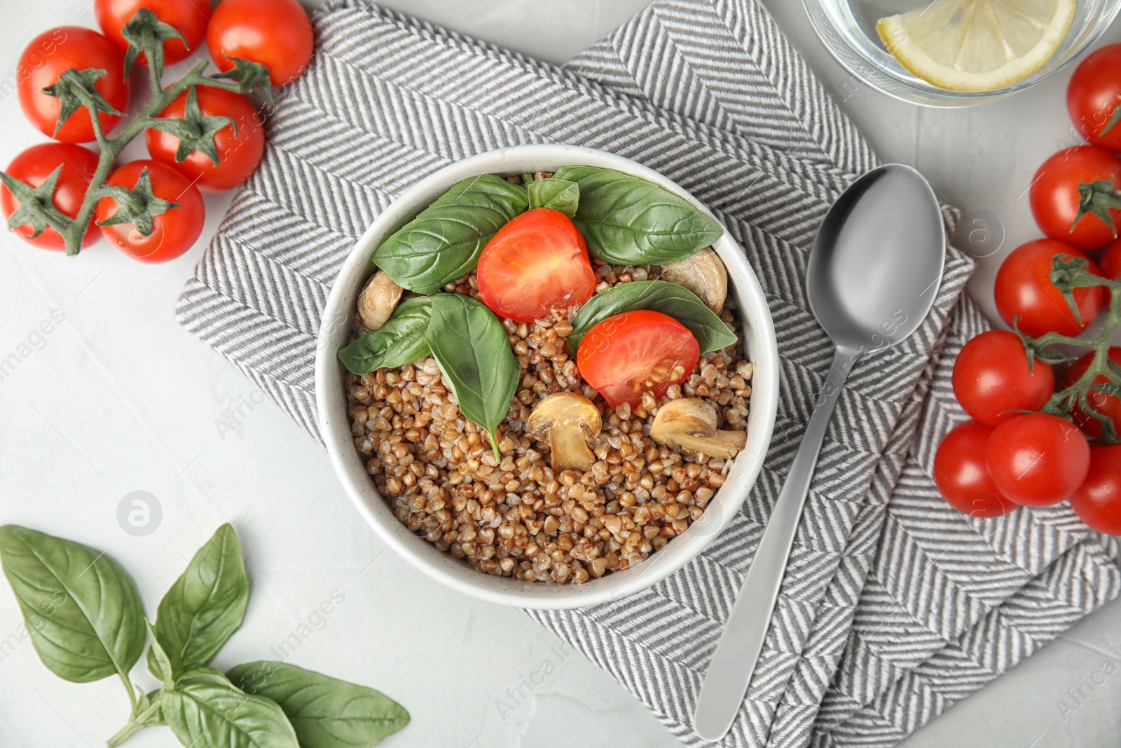 Photo of Flat lay composition with delicious buckwheat porridge on table