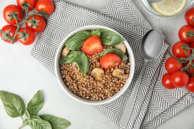 Flat lay composition with delicious buckwheat porridge on table