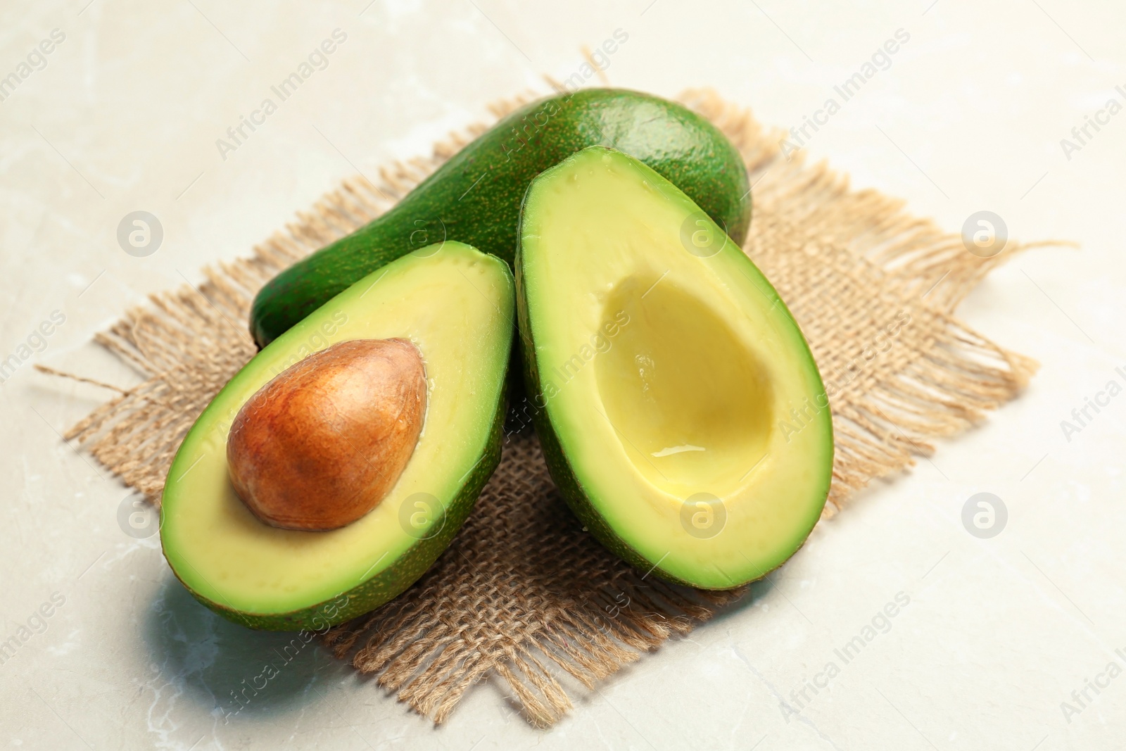 Photo of Tasty ripe avocados on table. Healthy diet