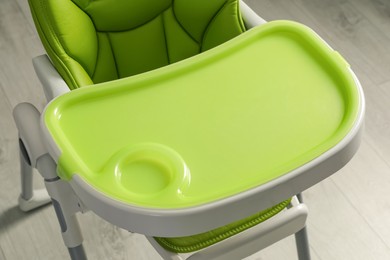 Photo of Green baby high chair indoors, above view