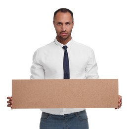 Upset man holding blank cardboard banner on white background, space for text