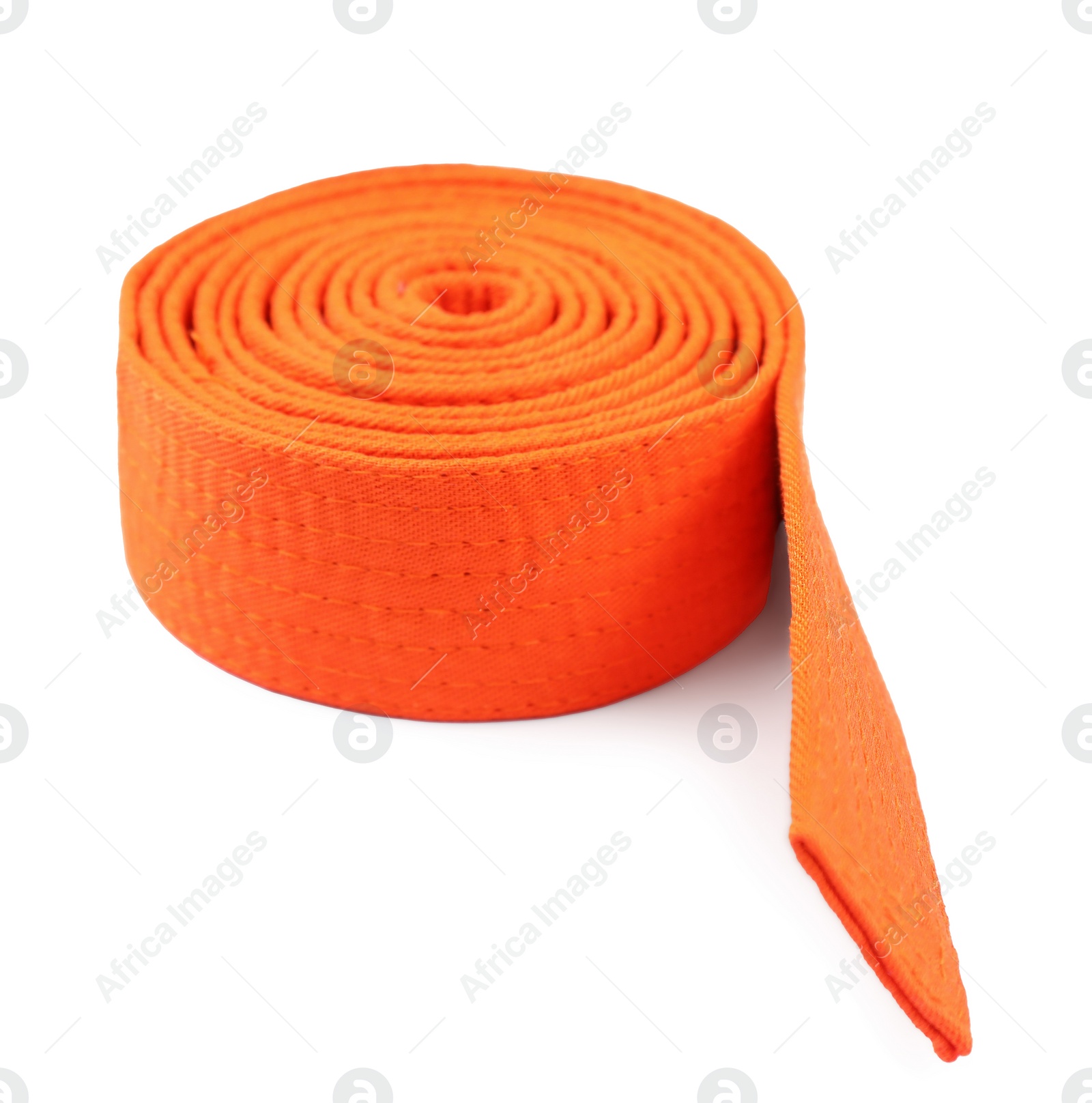 Photo of Orange karate belt isolated on white. Martial arts uniform