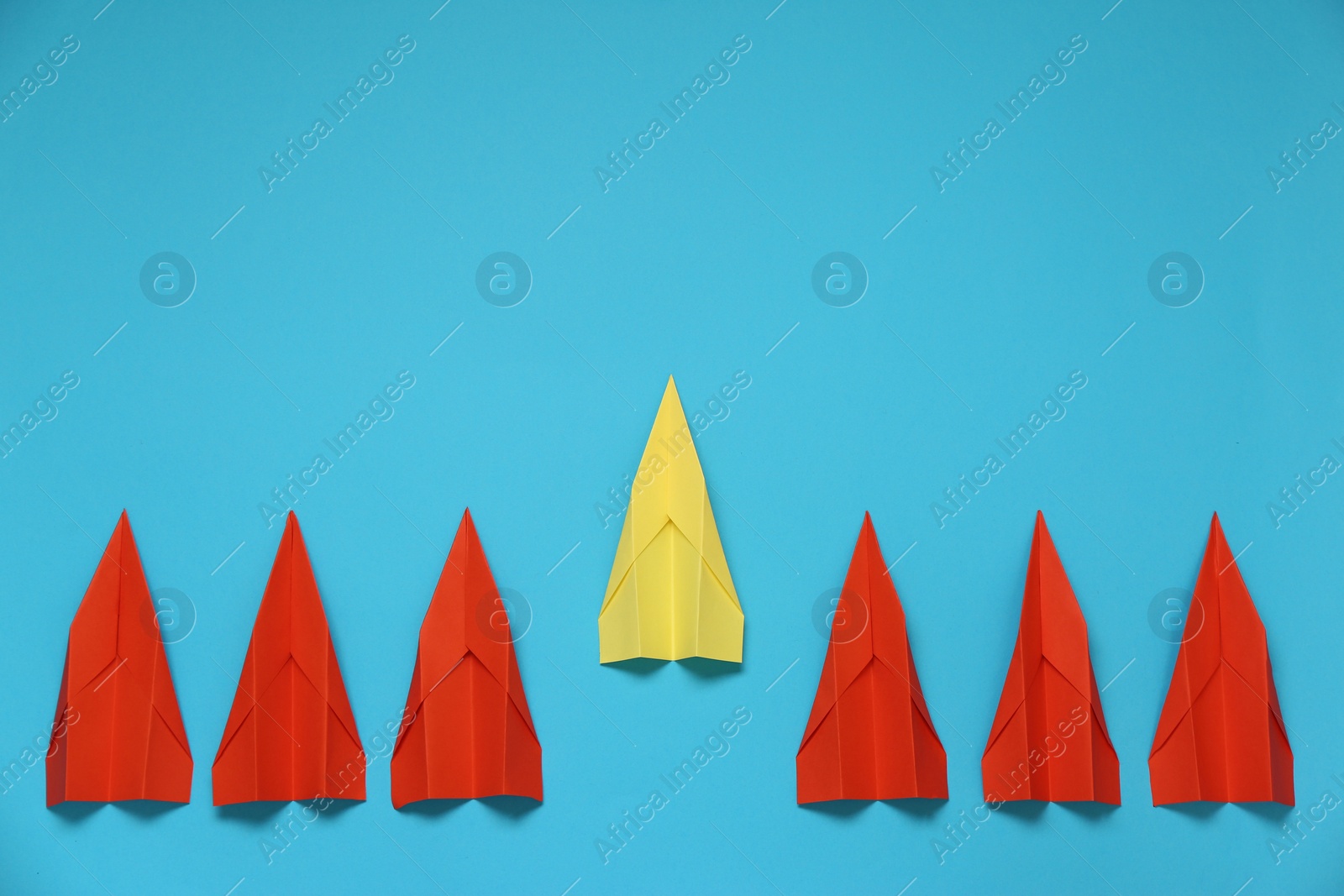 Photo of Flat lay composition with different paper planes on light blue background, space for text