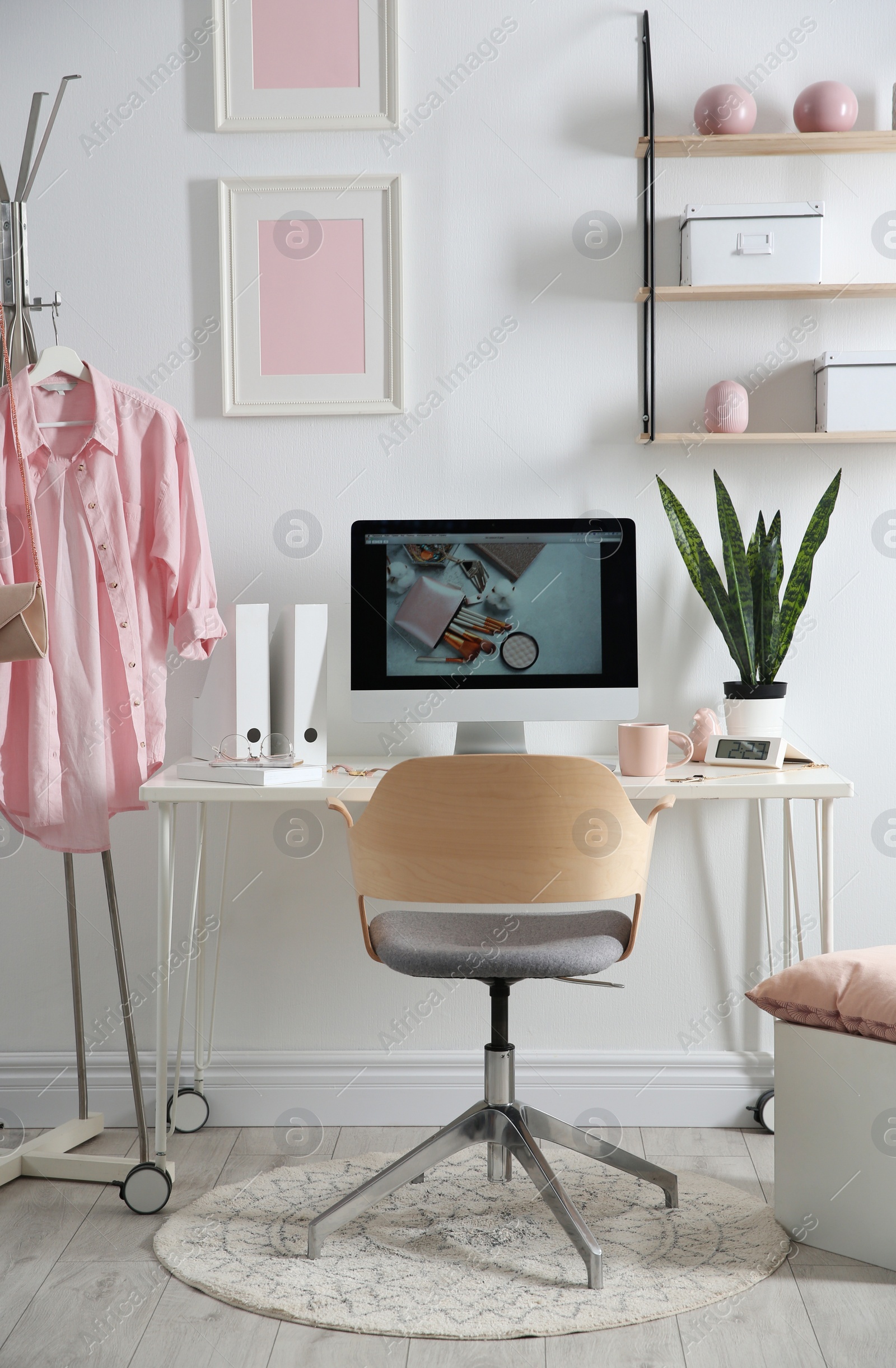 Photo of Comfortable workplace with computer on desk in home office