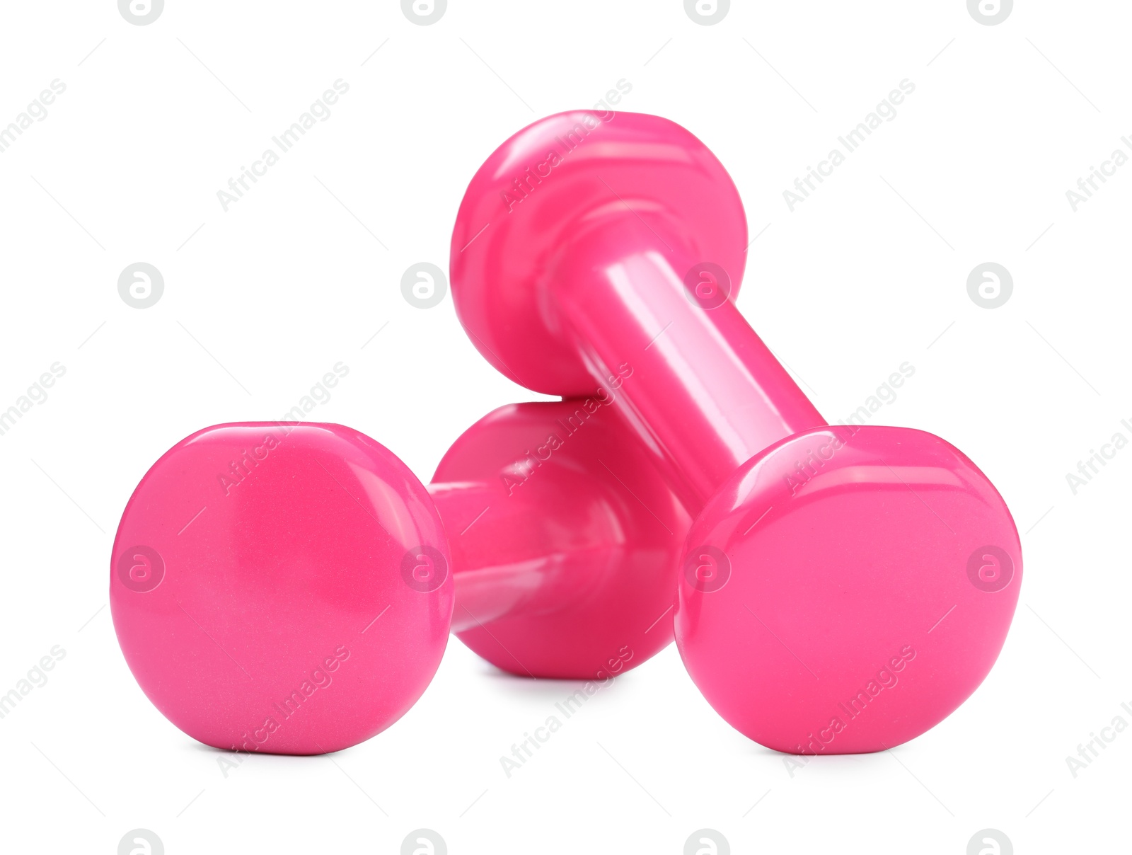 Photo of Pink dumbbells isolated on white. Sports equipment