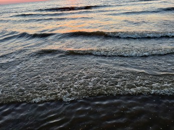 Beautiful view of sea waves at sunset