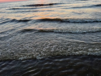 Photo of Beautiful view of sea waves at sunset