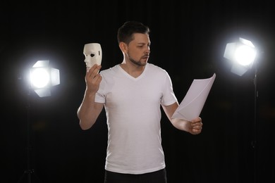 Professional actor reading his script during rehearsal in theatre