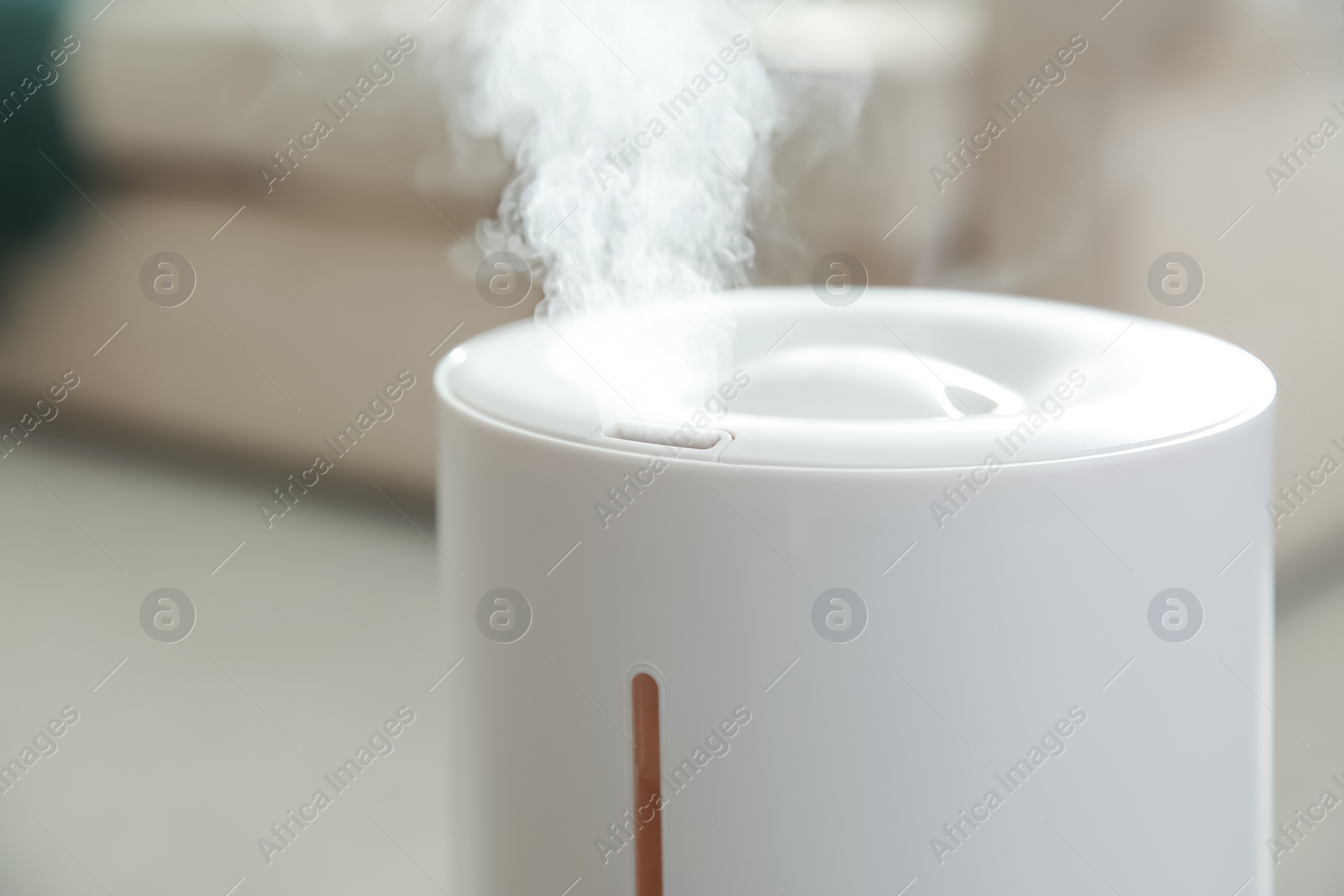 Photo of Modern air humidifier at home, closeup view