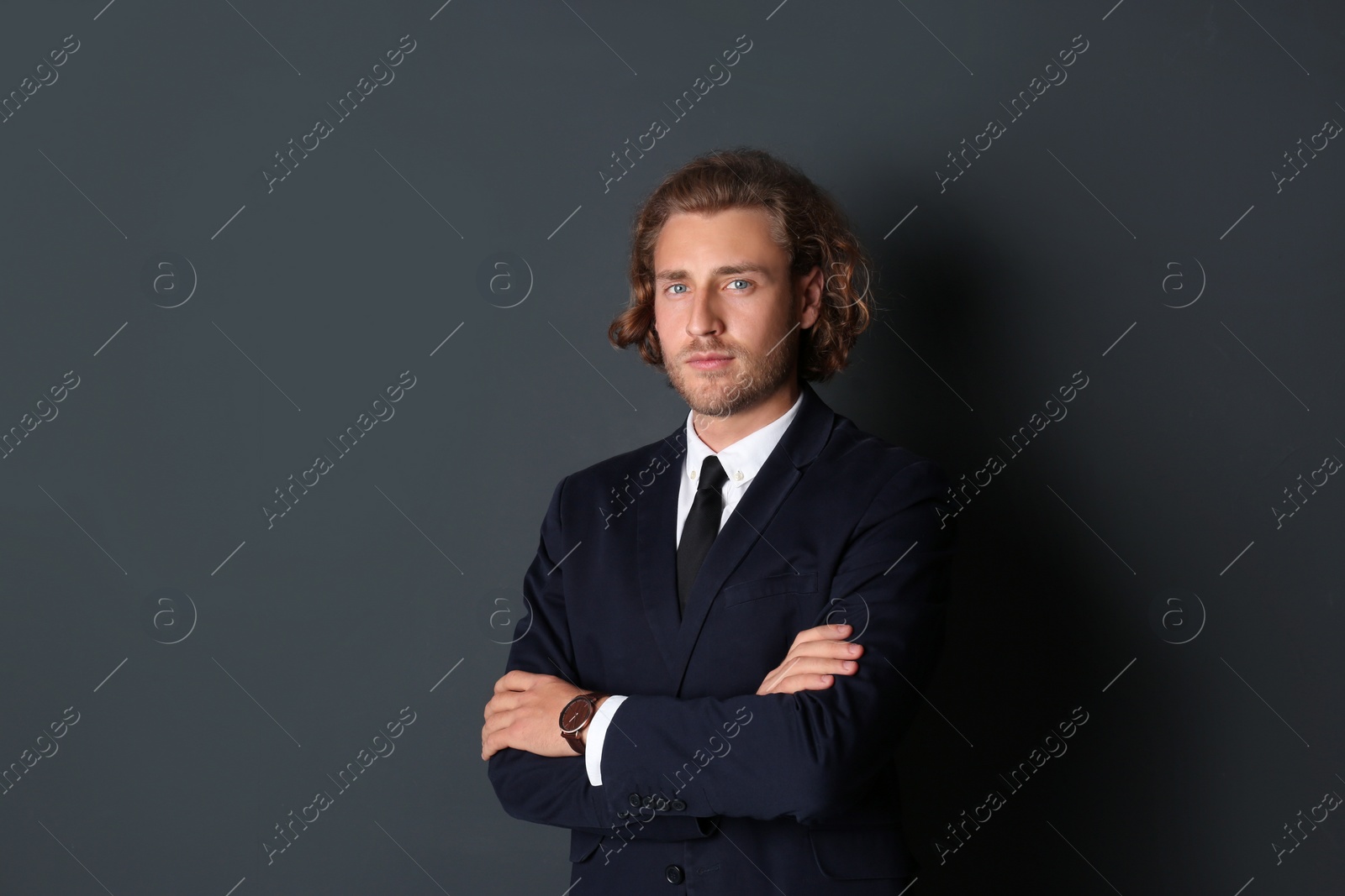 Photo of Portrait of handsome man on dark background