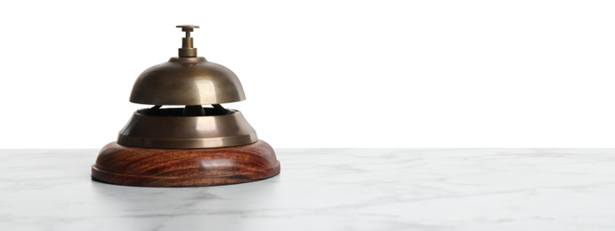 Hotel service bell on marble table against white background