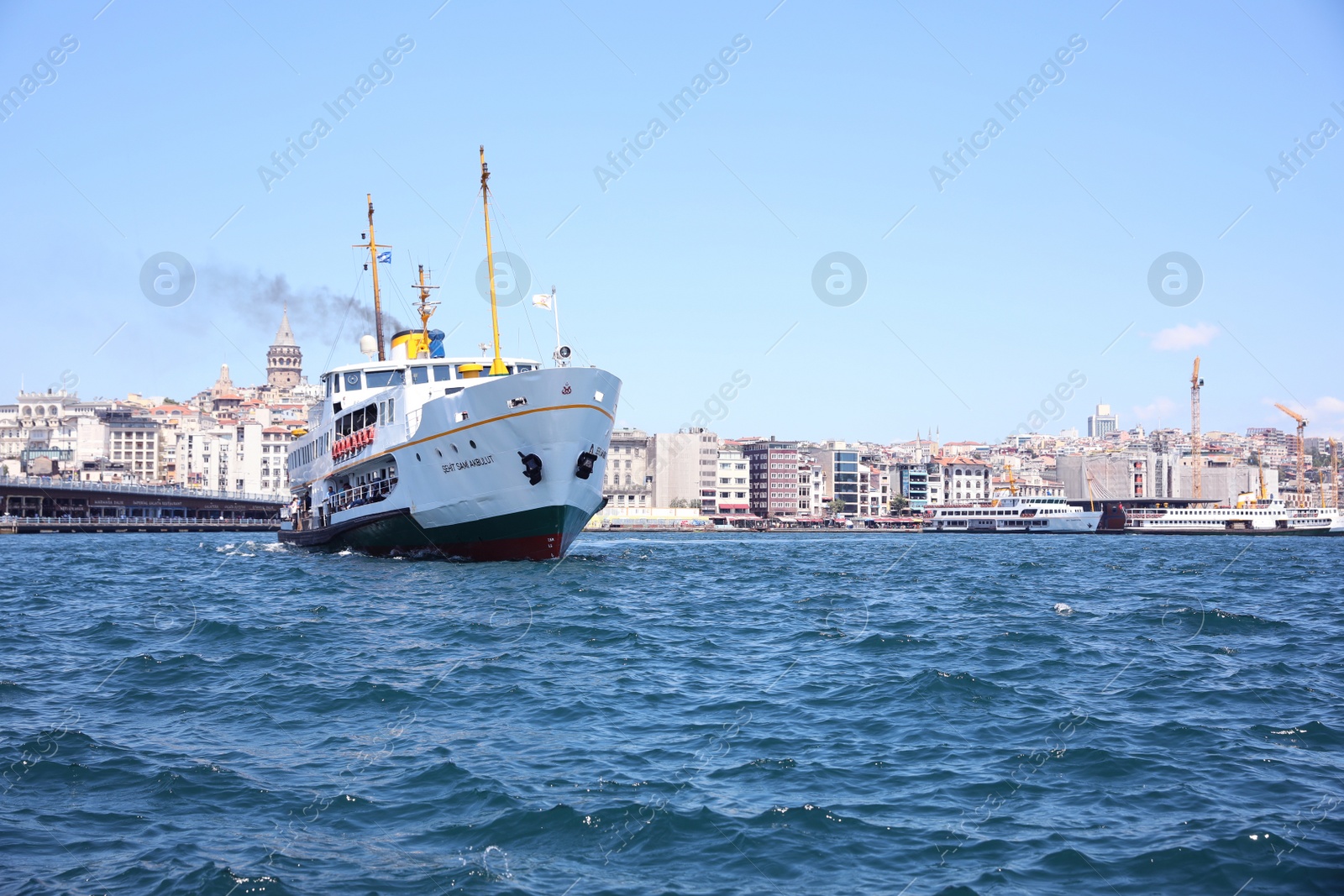 Photo of ISTANBUL, TURKEY - AUGUST 10, 2019: Bosphorus strait with maritime transport and city on sunny day