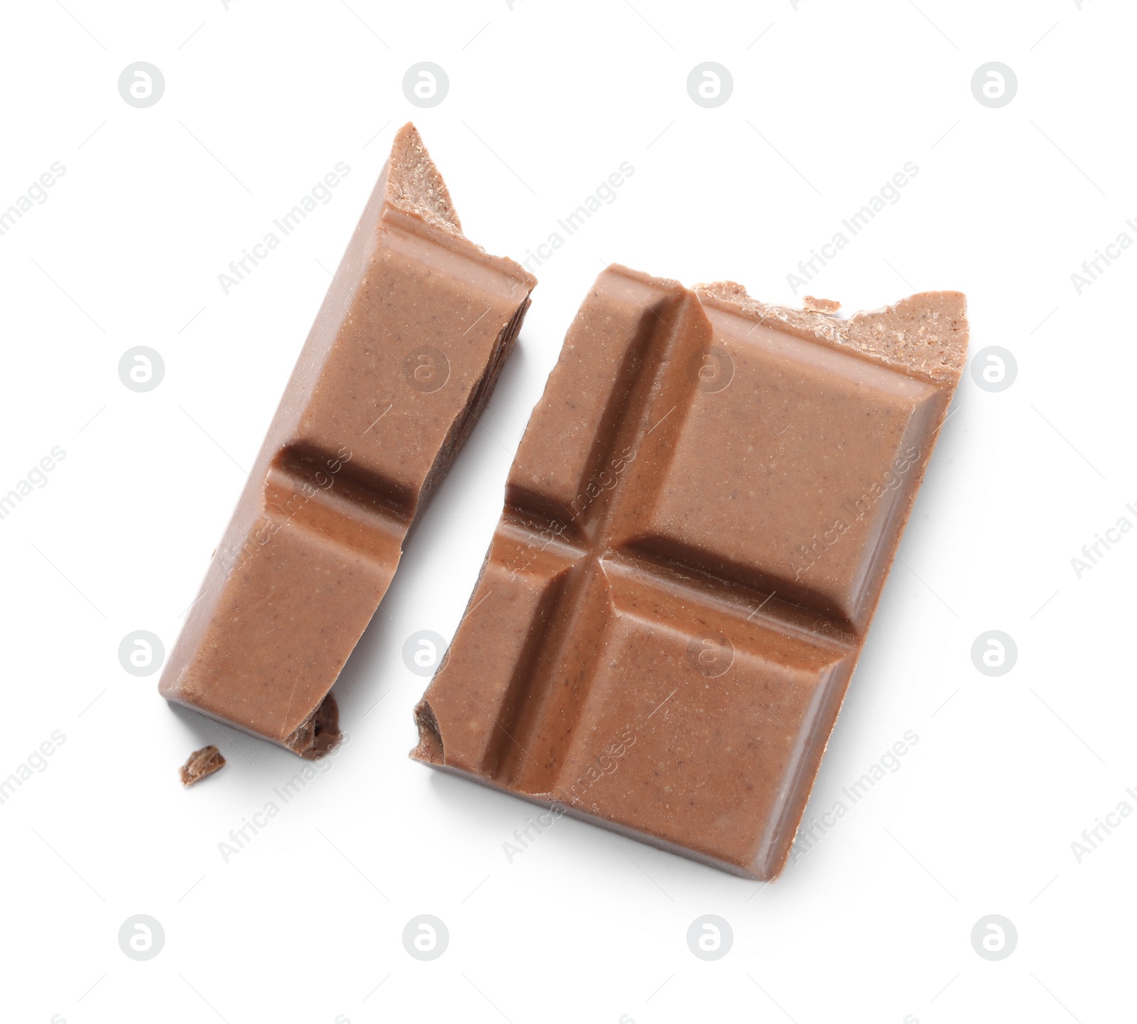 Photo of Pieces of delicious milk chocolate isolated on white, top view