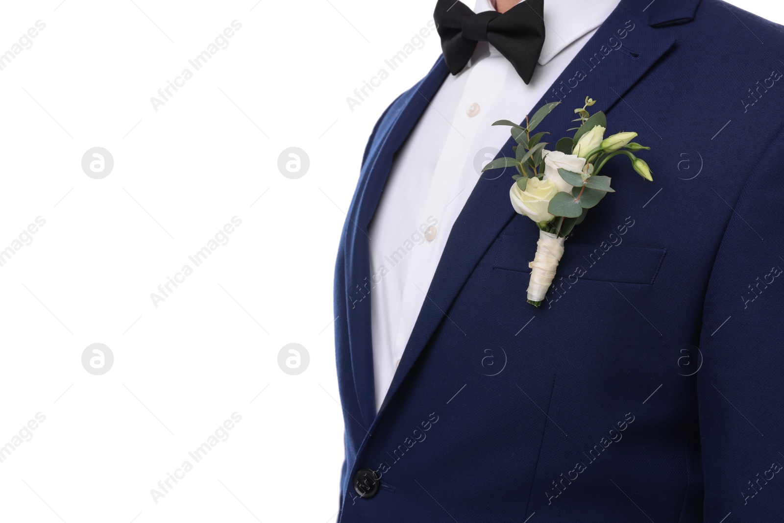 Photo of Groom with boutonniere on white background, closeup. Wedding accessory