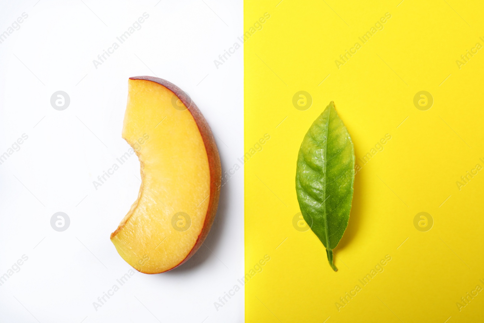 Photo of Flat lay composition with ripe peach and leaf on color background