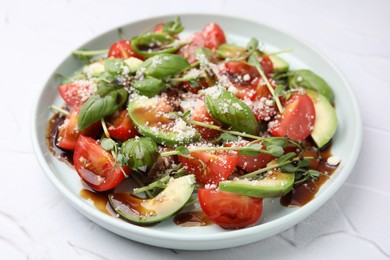 Tasty salad with balsamic vinegar on white textured table