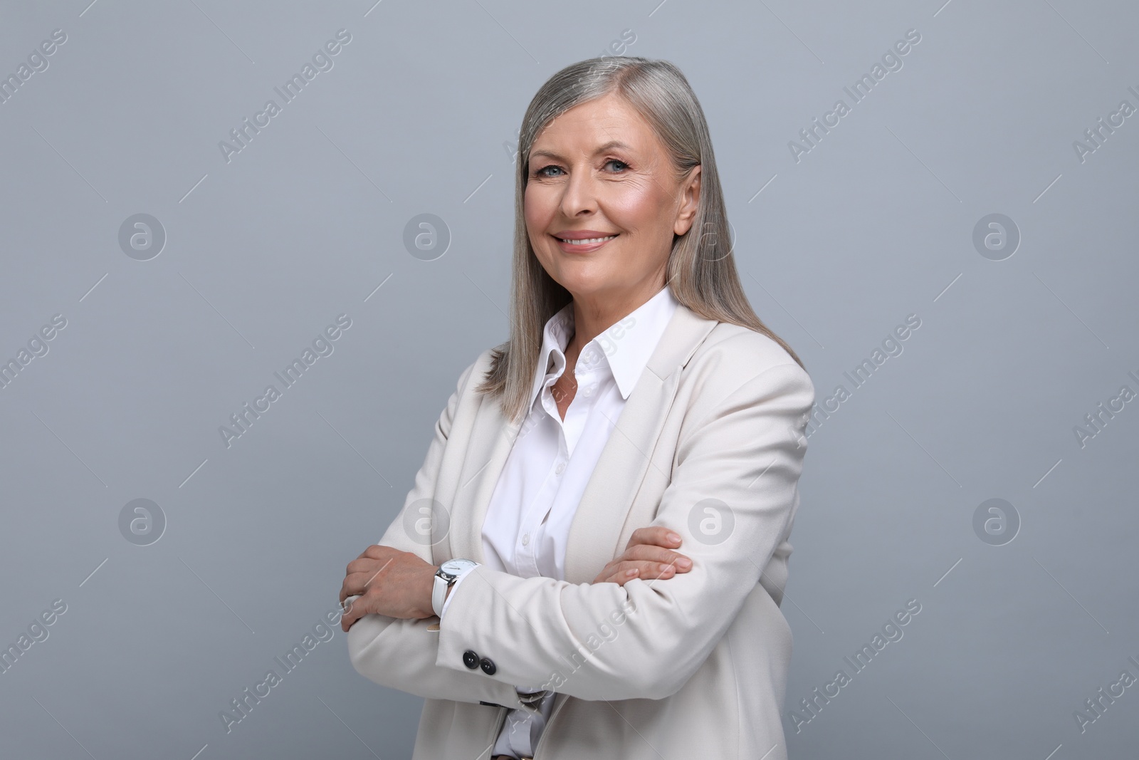 Photo of Portrait of beautiful senior woman on grey background