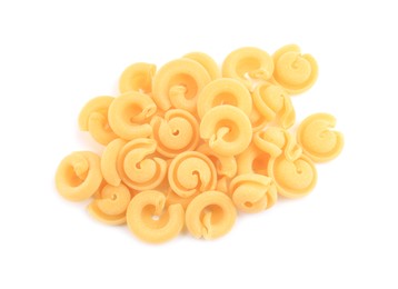 Photo of Pile of raw dischi volanti pasta isolated on white, top view