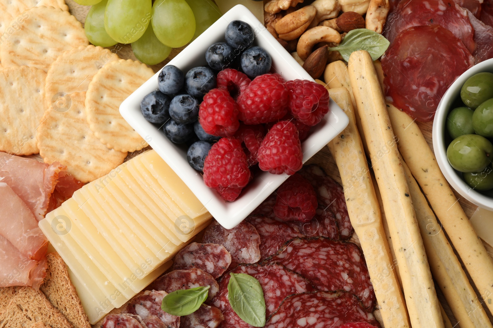 Photo of Snack set with delicious Parmesan cheese, top view